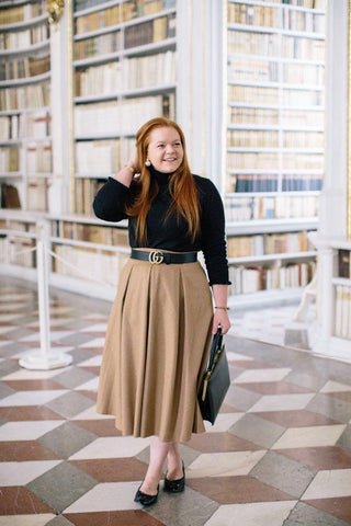 Turtleneck Sweater Paired with Pleated Skirt