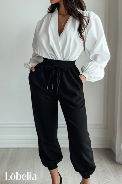 black sweatpants With a White Blouse and Heels